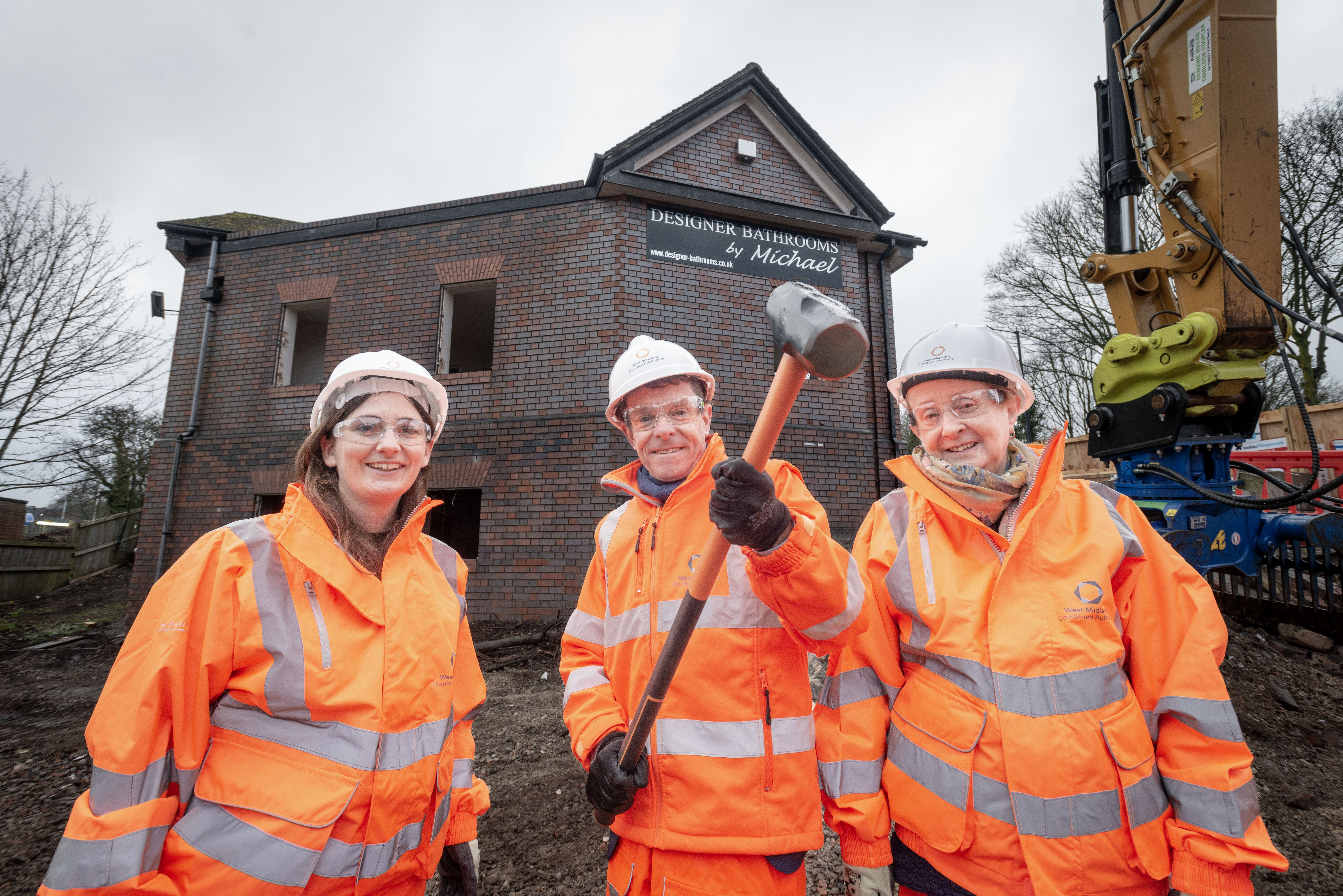 Cllr Brigid Jones, Mayor Andy Street and Cllr Mary Locke in front of the old showroom being pulled down